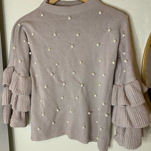 It is size S, it was only used once it's a low pink color